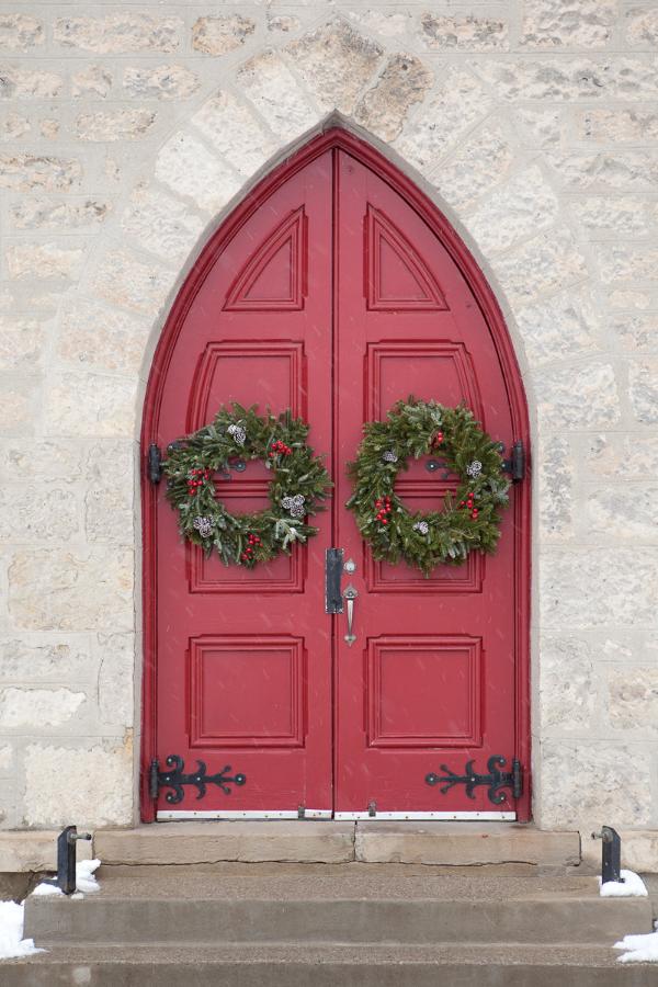 Red Door with Christmas Wreaths in snowfall Photo by Cambridge Ontario Photographer Laura Cook of Vision Photography